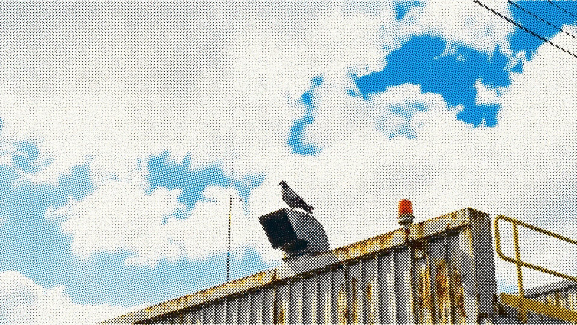 Halftone image of industrial equipment against a blue sky