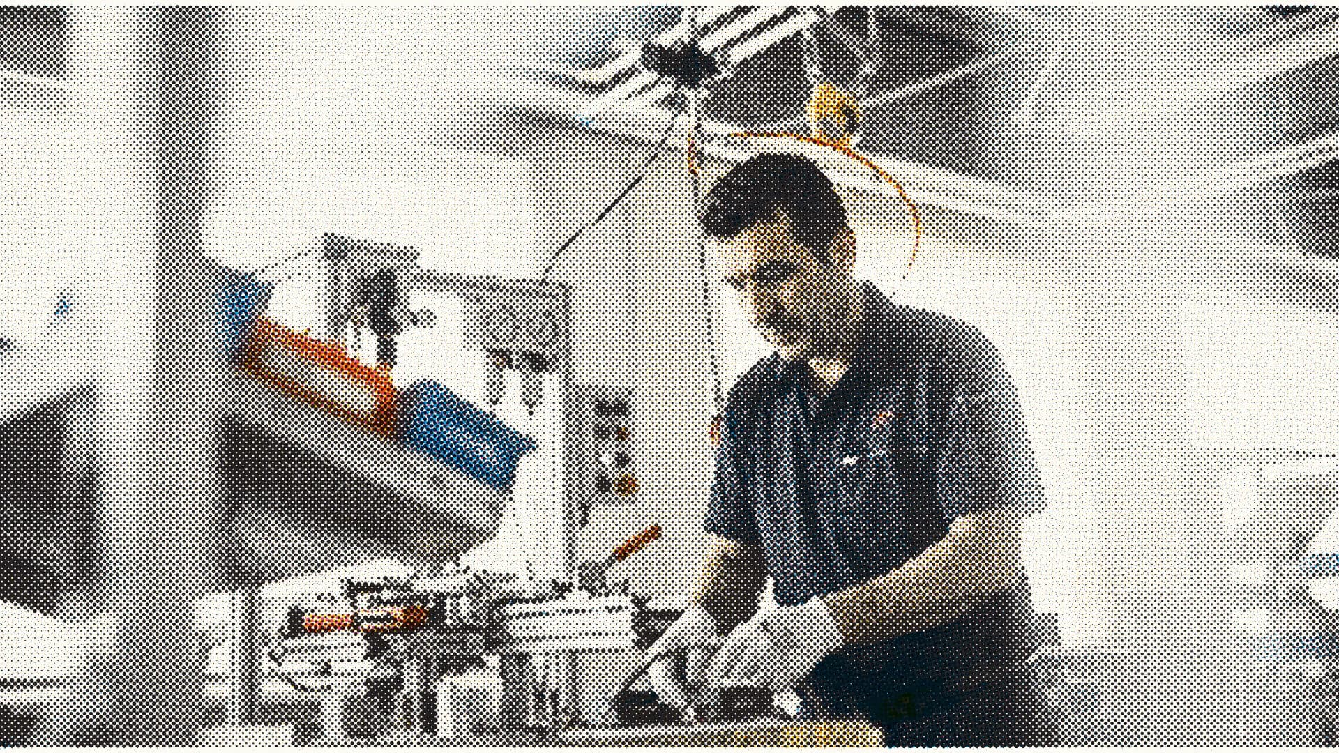 Worker inspecting equipment in a production setting