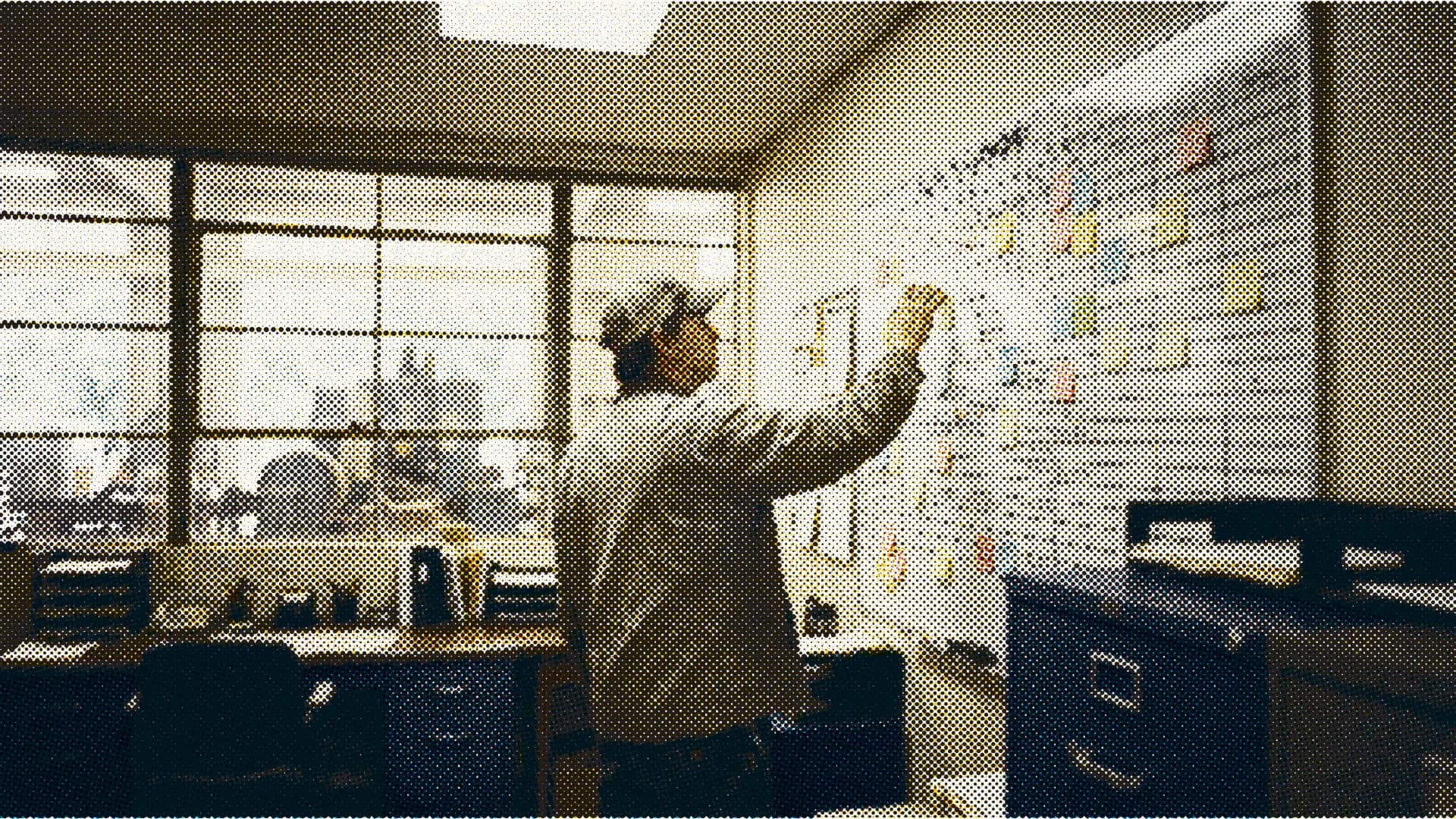 Operations manager at a production schedule whiteboard